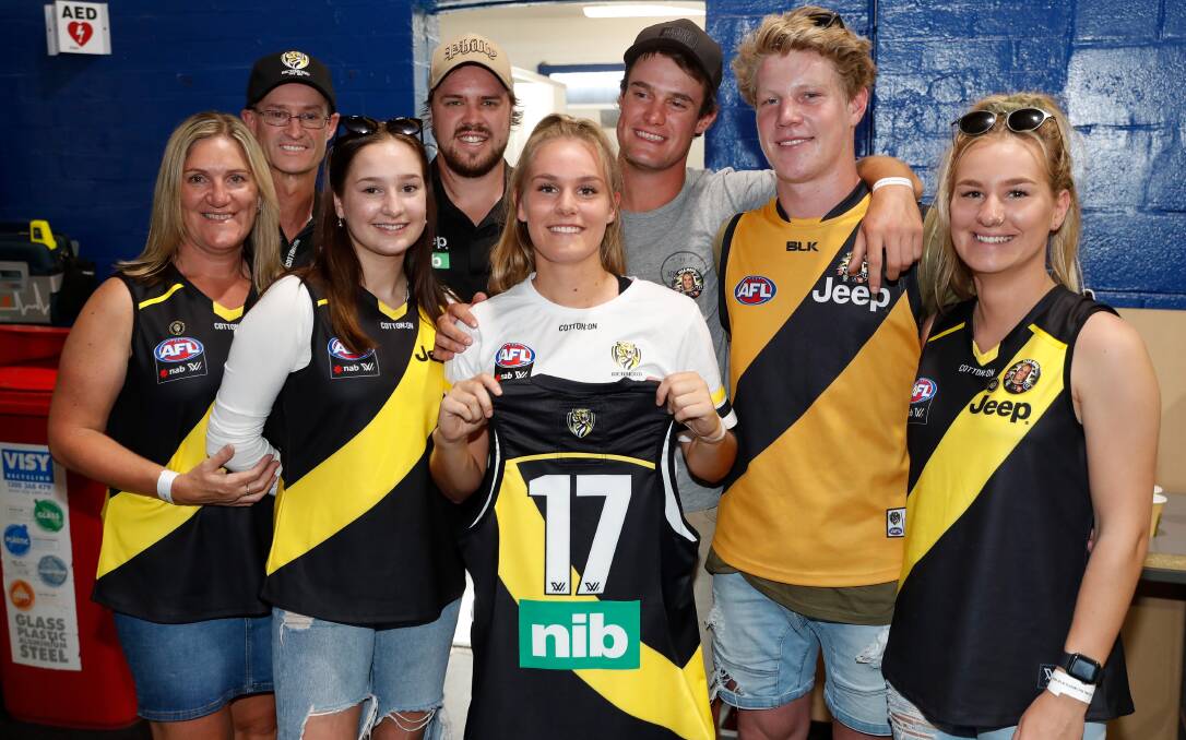 STOKED: Ella Wood with family ahead of her first AFLW game on Sunday. It is Wood's first season with the Tigers. Picture: MICHAEL WILSON/RICHMOND MEDIA