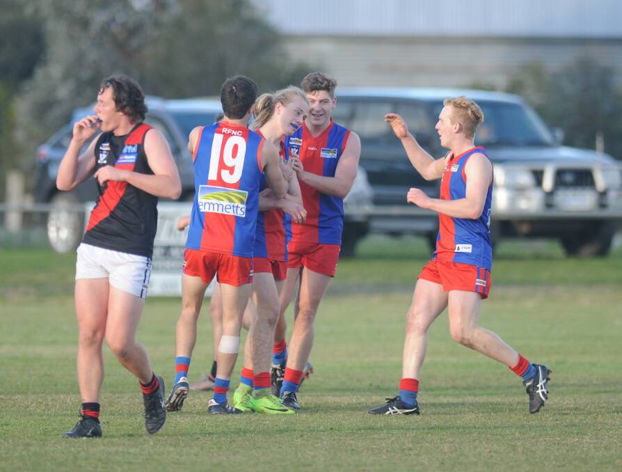 Rupanyup get around William Saligari after he boots his first goal in senior football in the third term.