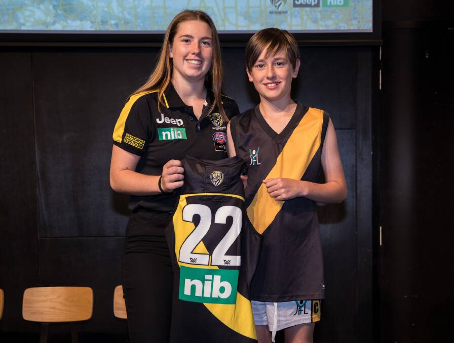 Butler with a young Richmond supporter at the Tigers' season launch. 