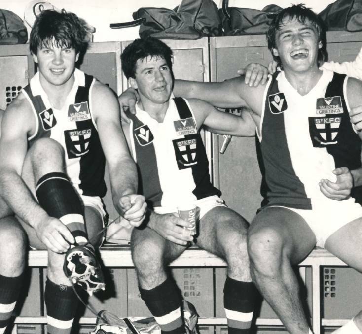 SAINTS COME MARCHING IN: Ballarat exports Danny Frawley, Peter Kiel and Tony Lockett after a St Kilda win in 1984.