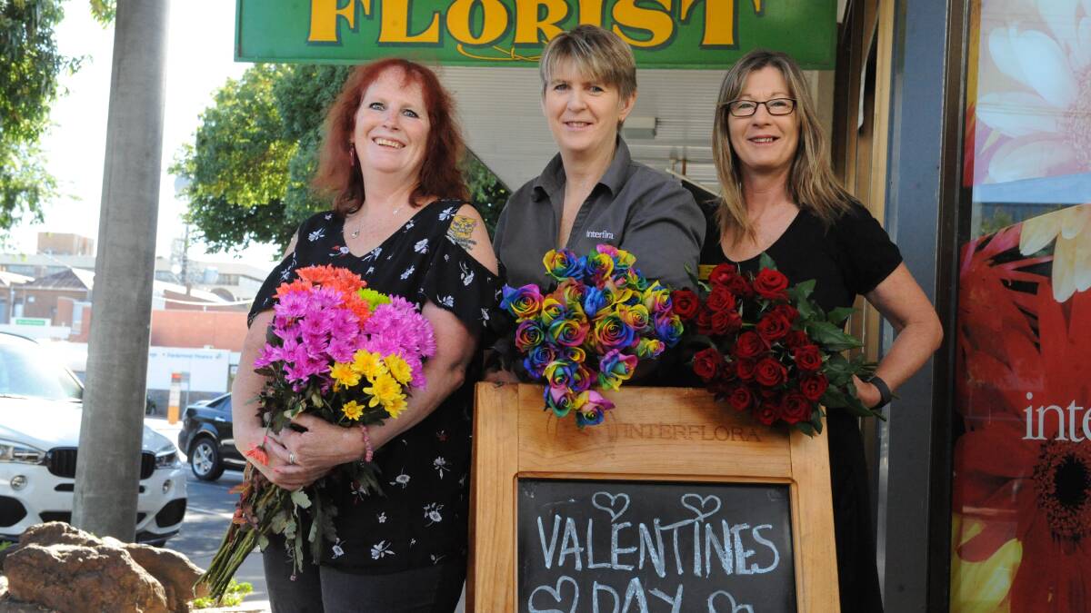 ROSES GALORE: Horsham Florist owners Rosemary Arnott, Susan McQueen and Heather Harrison ready for Valentine's Day. Picture: SEAN WALES