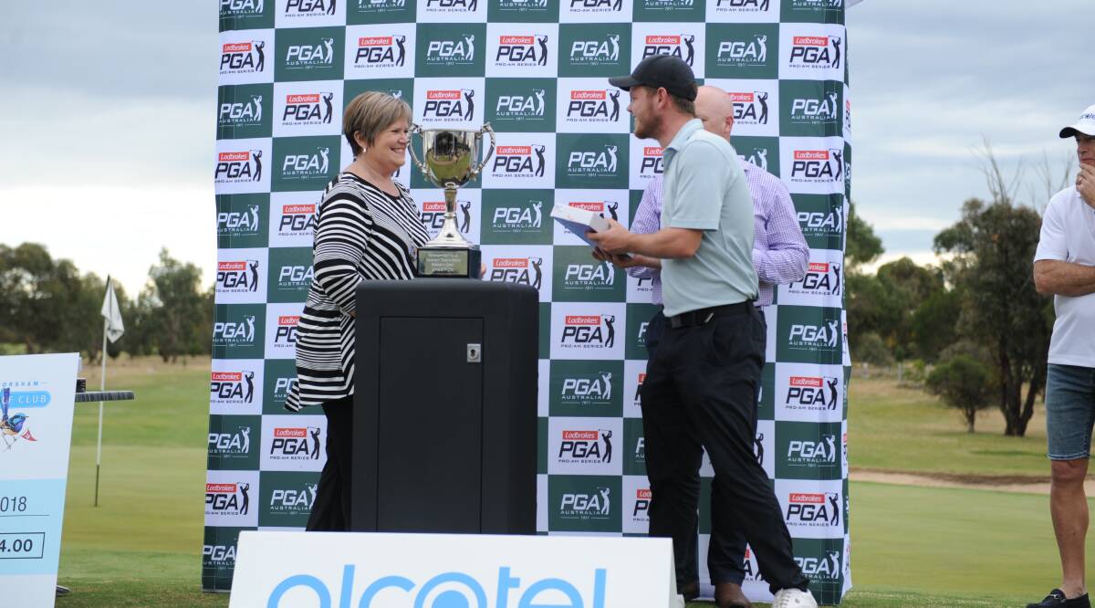 Horsham's Lewis Gebert collects his award for finishing second in the amateurs. 