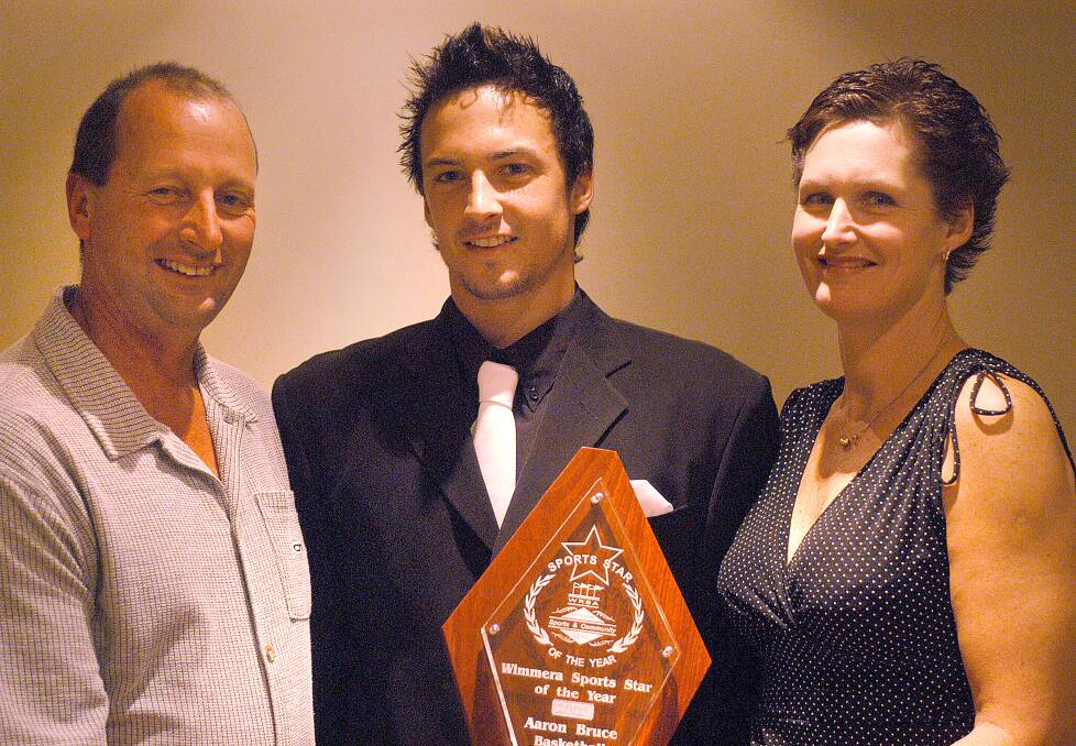 Aaron Bruce won the 2003 Wimmera Sports Star of the Year. Pictured with parents Steve and Julie Bruce.