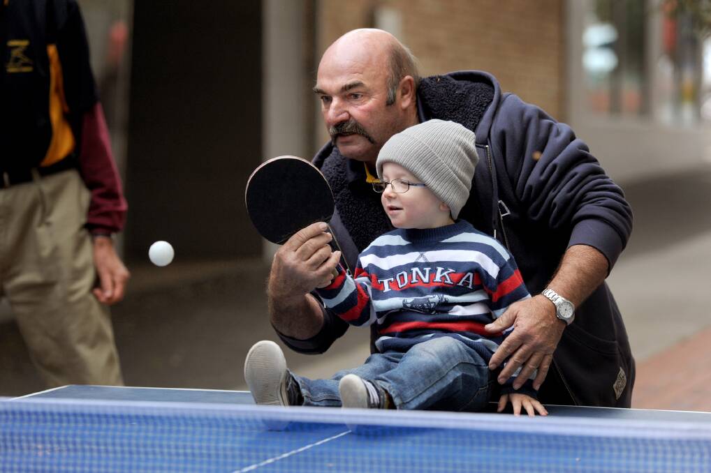 Horsham Table Tennis Association member Jeff Pekin helps Horsham's Angus Crute celebrate World Table Tennis Day in 2015. Picture: SAMANTHA CAMARRI 