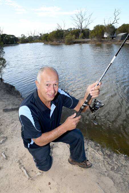 Jeparit Anglers Club's Paul Holmes at the Wimmera River at Jeparit.