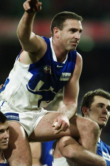 Craig Sholl is chaired off after the preliminary final in 2000 against Melbourne.