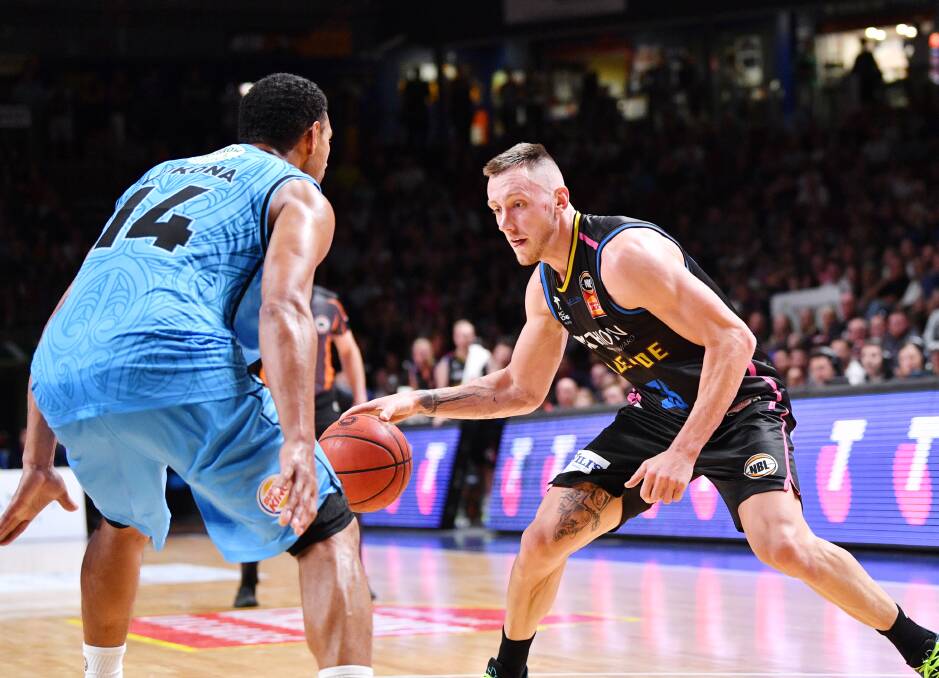BACK: Mika Vukona of the New Zealand Breakers and Mitch Creek of the Adelaide 36ers in action during their round 12 NBL clash. Picture: AAP