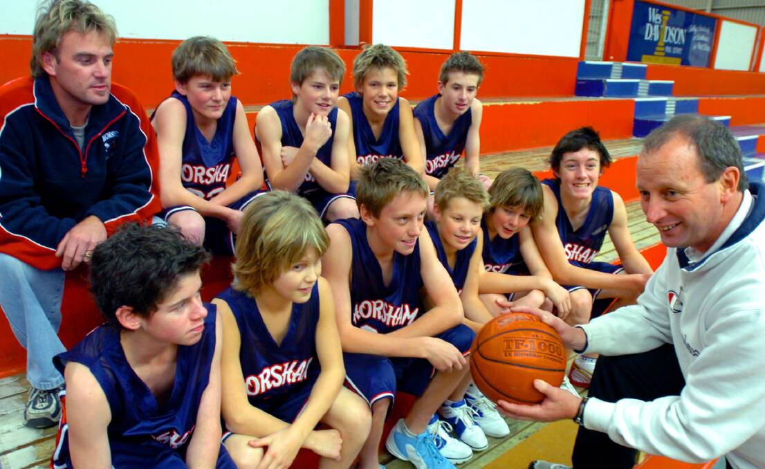 Steve Bruce with a team of junior basketball players from Horsham.