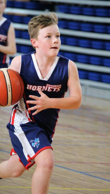 BACK ON COURT: Levi Munyard playing for the under-12s at Hamilton on Saturday. Picture: ANNE SLEEP