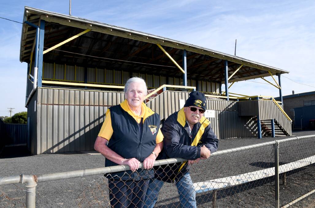 SAFETY CONCERNS: Nhill and District Sporting Club life members Yvonne and Jim Gladdis with the grandstand at Davis Park that is closed for safety issues. Picture: SAMANTHA CAMARRI