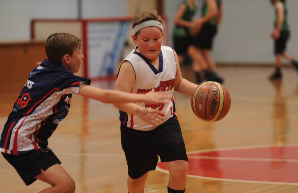 Under-12s Horsham basketballer Jaxon Crooks dribbles past his opponent at training on Wednesday. Picture: SEAN WALES