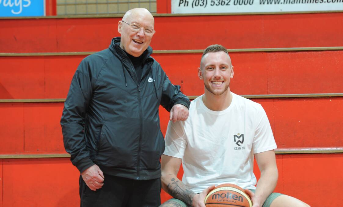 PROUD: Owen Hughan with former Horsham Hornet Mitch Creek. Creek is the first Wimmera basketballer to earn a contract with an NBA franchise. Picture: SEAN WALES
