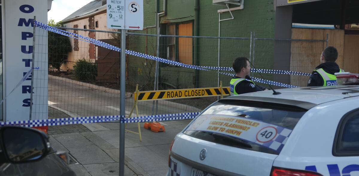 Police blocked off the alley next to the Commercial Hotel on Monday morning. Picture: SEAN WALES