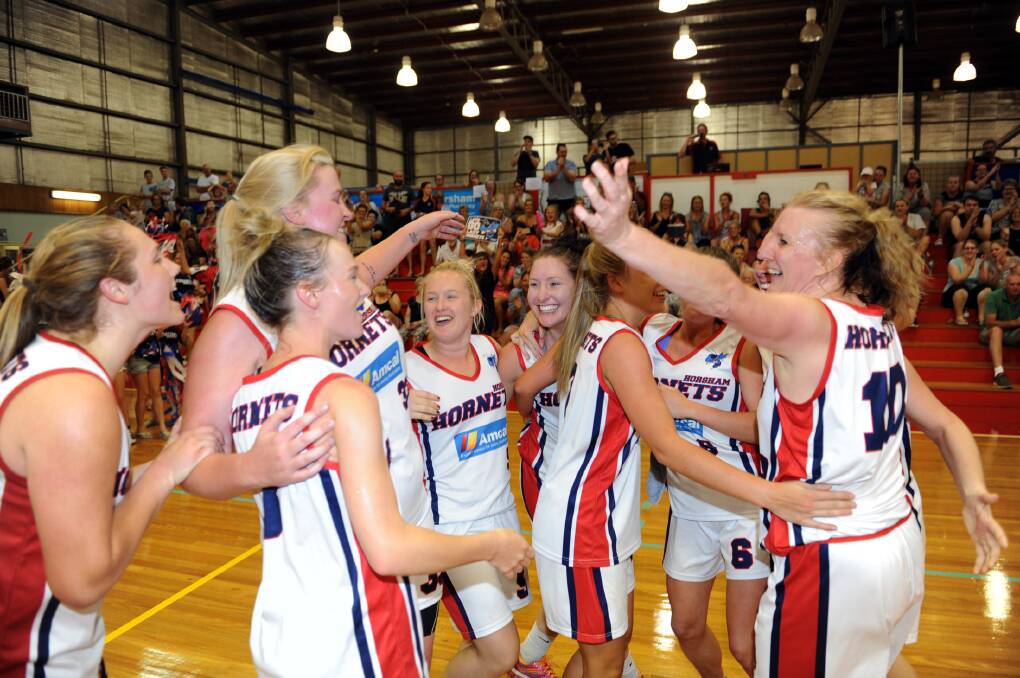 CHAMPIONS: The Lady Hornets celebrate winning the 2015/16 CBL grand final in front of their home crowd. 