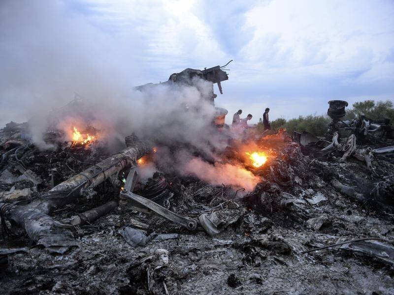 Burning debris of the Malaysia Airlines plane that was downed by a missile over UkraIne in 2014.