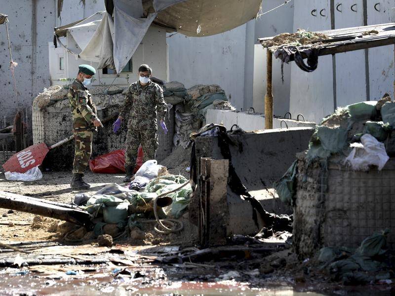 Taliban suicide bombers have killed dozens in separate incidents at an election rally and in Kabul.