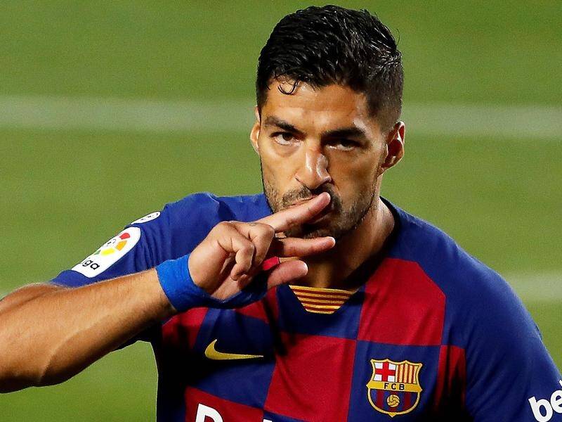 Luis Suarez celebrates scoring the only goal in the Barcelona derby with Espanyol at the Nou Camp.