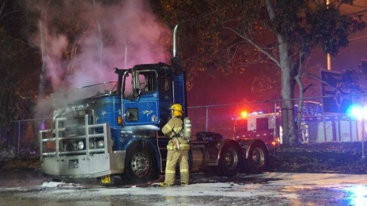 Four trucks were completely burnt out and a fifth truck sustained heat damage. Photo: Keith Pakenham