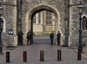 A man in a hood and mask and armed with a crossbow got into the Windsor Castle grounds last year. (AP PHOTO)