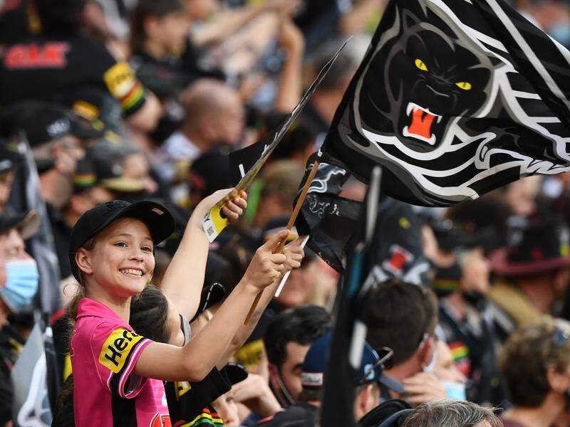 A reduced capacity crowd at Suncorp Stadium has embraced the first NRL grand final in Brisbane.