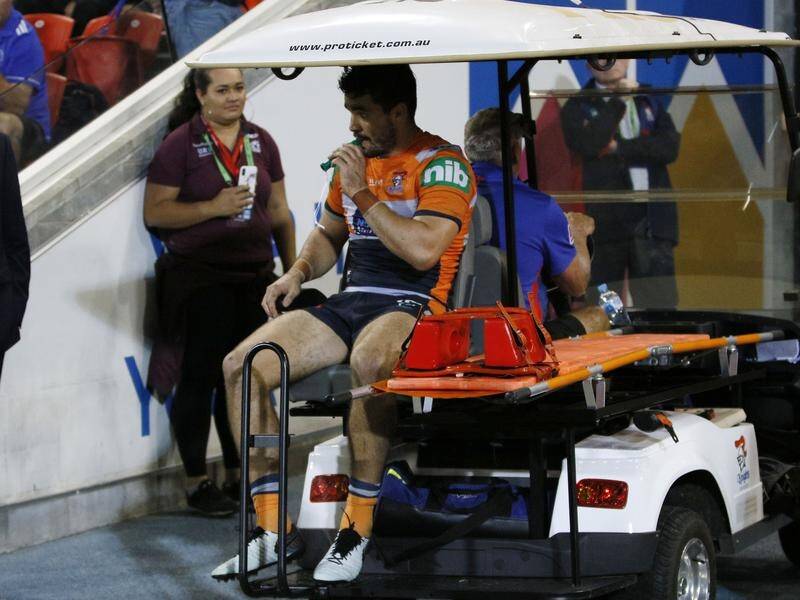 Newcastle forward Aidan Guerra in the medicab after injuring his leg against Manly.