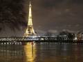 Paris has been lashed by rain as storms belt Britain and France. (AP PHOTO)