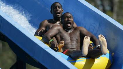 FAIRFAX. SPORT. CRICKET. WEST INDIES.  Wavell Hinds  front  and Jermaine Lawson from the West Indies Cricket team on  a slide at  Wet n  Wild on the Gold Coast before next weeks test match in Brisbane.  Picture by Paul Harris. Photo: Paul Harris