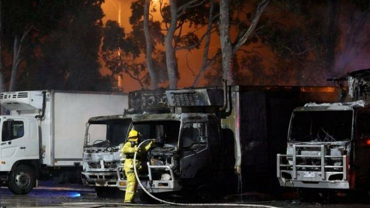 CFA and MFB crews extinguish five large trucks on fire in Braeside. Photo: Keith Pakenham