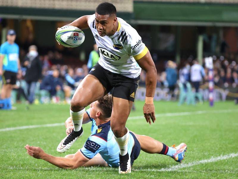 Julian Savea steps out of a Ben Donaldson tackle to score as the Hurricanes beat NSW in Super Rugby.