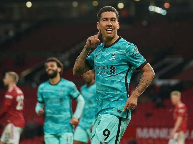 Roberto Firmino celebrates after scoring in Liverpool's 4-2 win over Manchester United.