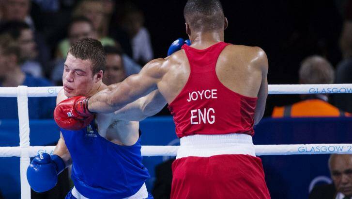 Outboxed: Joe Joyce of England pins Joe Goodall of Australia. Photo: James Brickwood