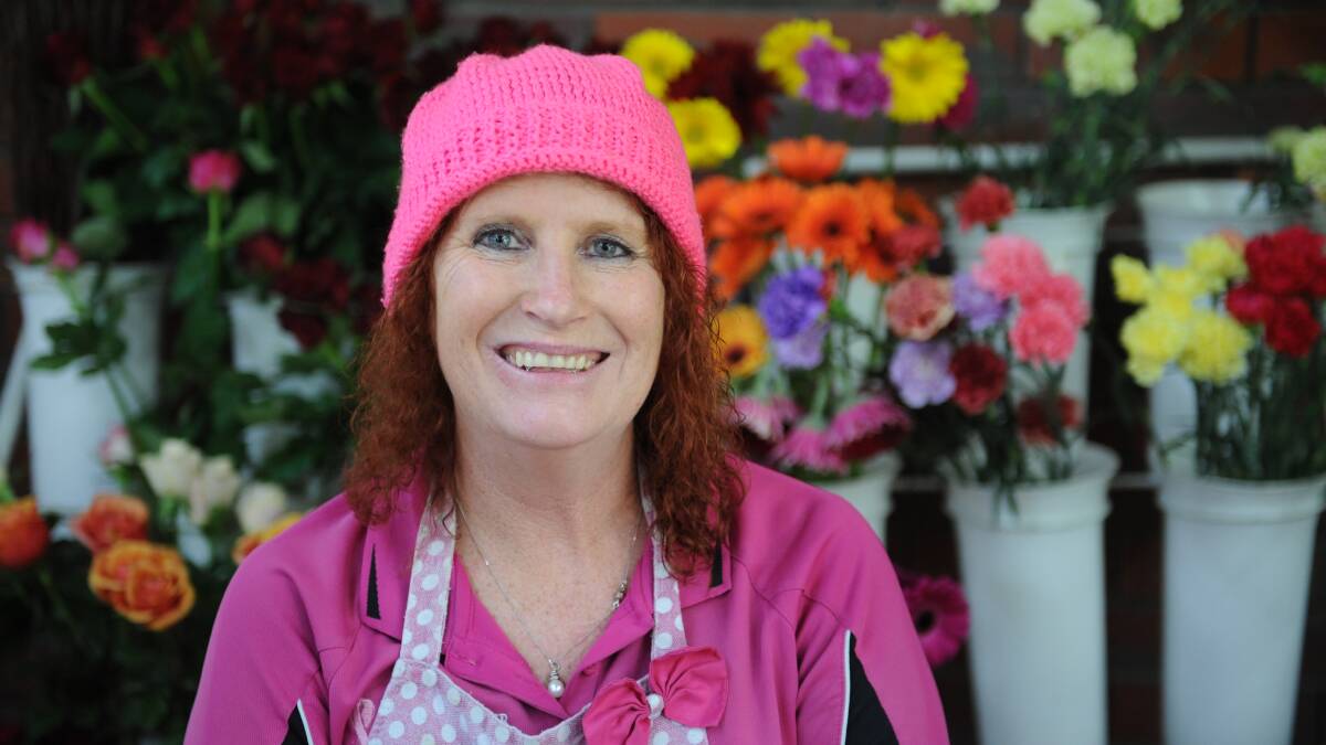 ALL SMILES: Rosemary Arnott at her flower shop gearing up for Mother's Day Picture: SONIA SINGHA