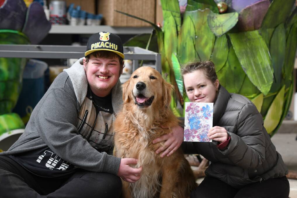 CREATIVE: Andrew Kent and Alex Barlow with golden retriever Ruby. Picture: SAMANTHA CAMARRI