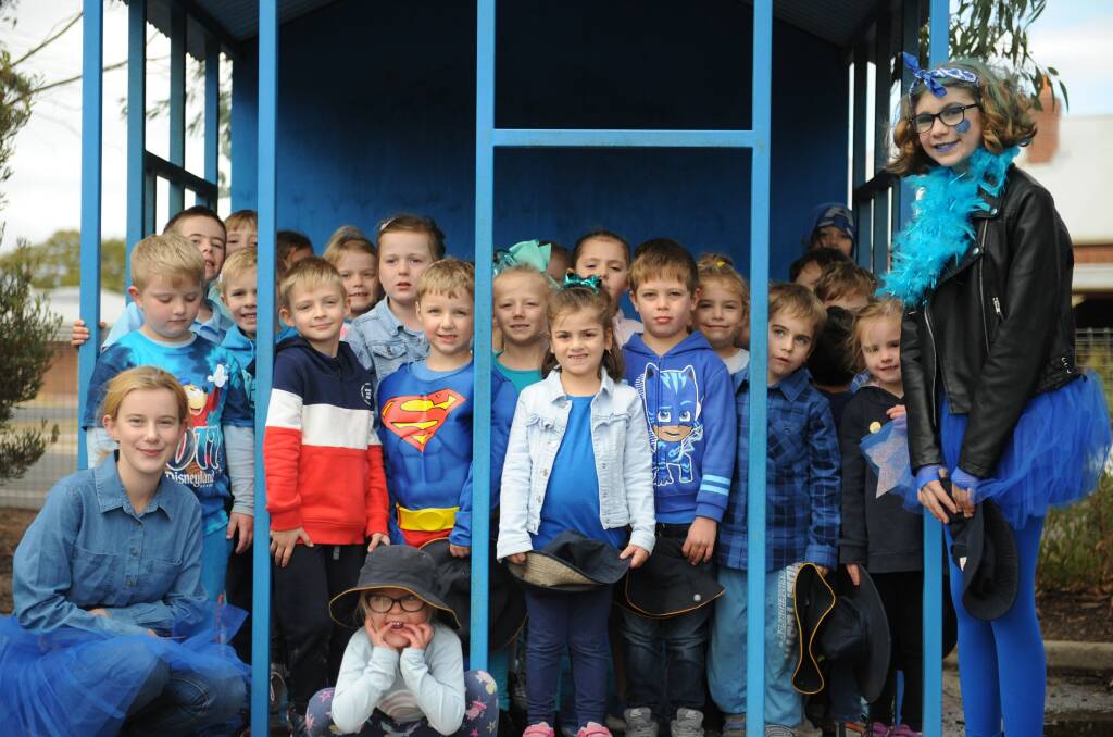 BLUE TRIBUTE: Katie Pohlner left, and Hanna Poswiat, right, with some of the Horsham West Primary School students dressed in blue to recognise and raise awareness of bullying, in honour of Dolly Everett. Picture: SONIA SINGHA