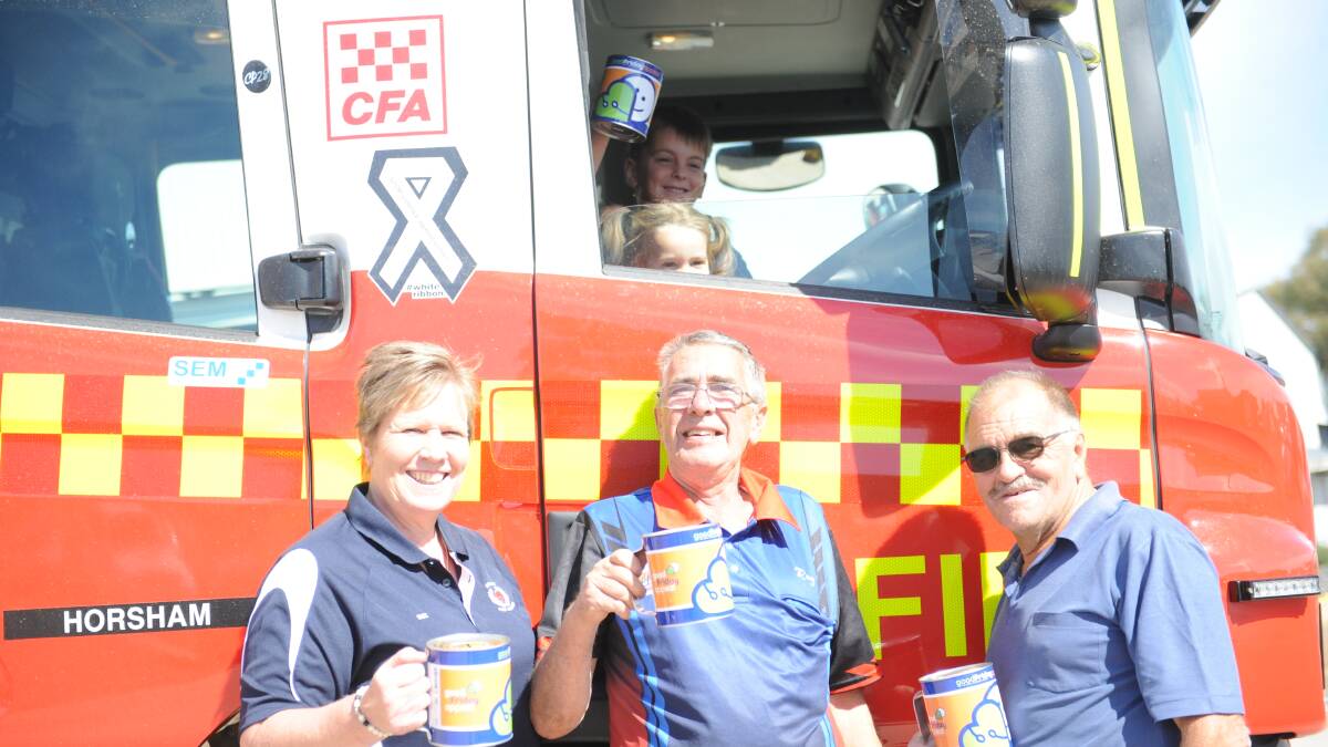 COMMUNITY FUNDRAISERS: Firefighters Sue Martin, Ray Carman and John Davies with 2-year old Abigail Dossett and 5-year old Jacob Dossett. Picture: SONIA SINGHA