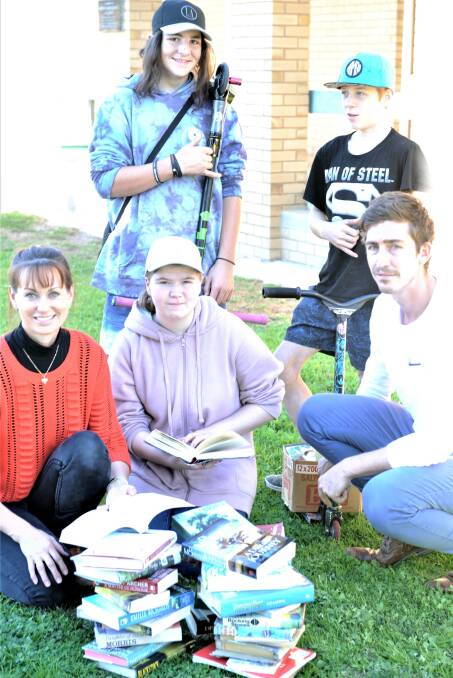 BOOK LOVERS: Organiser Yolande Grosser, year nine students Kyle Ditteo, Aaron Hale, Teimia Gooch and teacher Liam Offer gearing up for the book fair. Picture: SONIA SINGHA