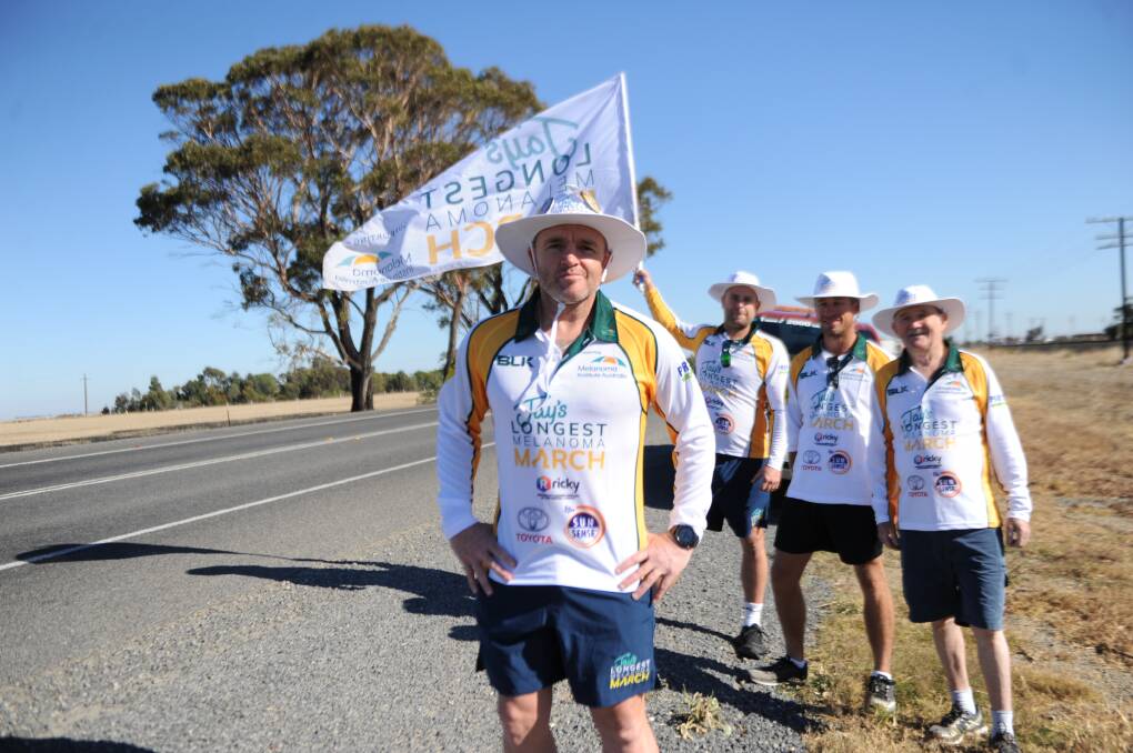 BATTLE MELONAMA: Jay Allen alongside fellow marchers Ben De Young, Tim Page and Woofe Nash walking from Pimpinio to Horsham on Western Highway. Picture: SONIA SINGHA