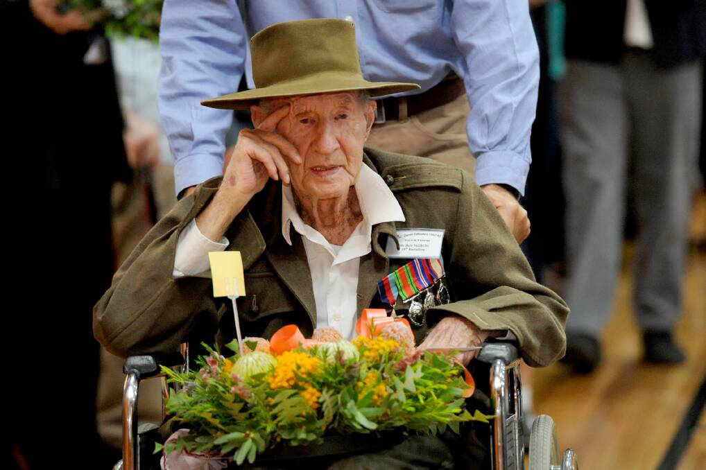 TRIBUTE: Bob Sudholz, who served in Darwin 73 years ago, lays a wreath on behalf of members of the Darwin Defenders Horsham Committee at the 73rd Darwin Defenders commemoration service at Horsham College Hall. Picture: PAUL CARRACHER