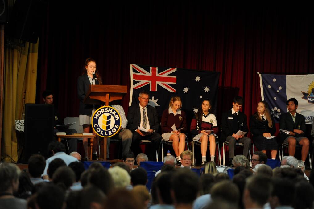 POIGNANT MOMENT: Horsham College school captain Maddison Crough speaks at the 73rd Darwin Defenders commemoration service at Horsham College yesterday. Pictures: PAUL CARRACHER