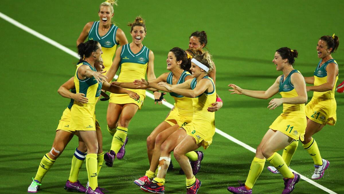 The moment it became real - the Hockeyroos celebrate their Commonwealth gold medal win against England. Photo: Paul Gilham, Getty Images Sport.