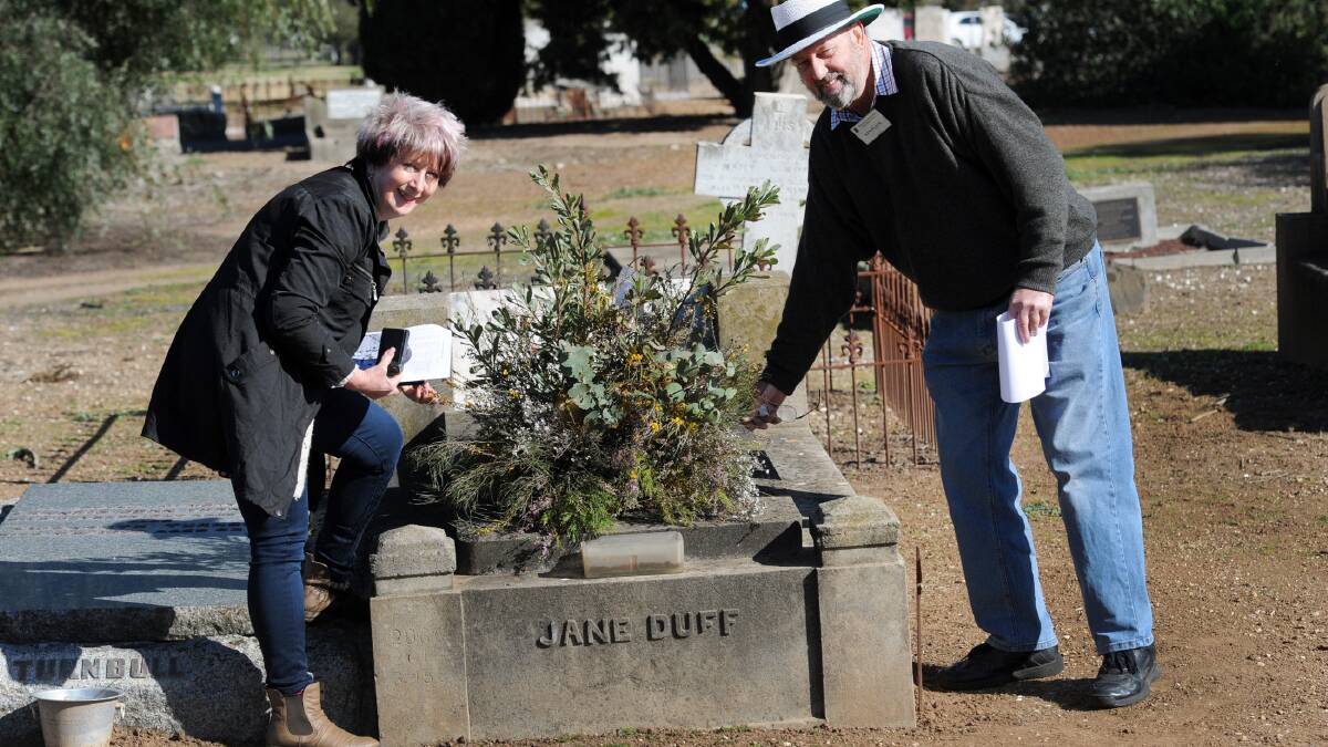 TOUR: Western Victorian Association of Historical Societies secretary Helen Curkpatrick and Wimmera Association of Genealogy president Ken Flack at the grave of Jane Cooper-Turnball, also known as Jane Duff, at Horsham cemetery, where a tour was held  on Sunday. Picture: PAUL CARRACHER
