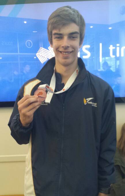 OUTSTANDING: Fergus Schier with the bronze medal he won at the Australian Junior Volleyball Championships in Canberra. Picture: CONTRIBUTED