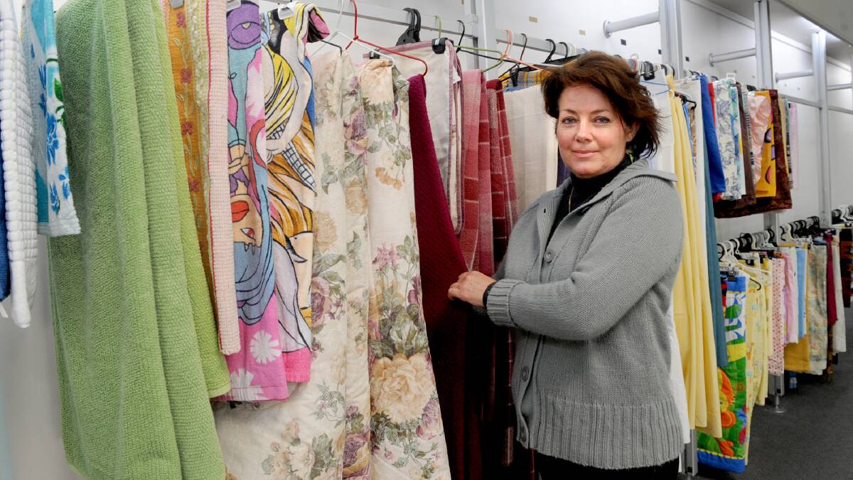 Trudy Mayer helps to set up the new Horsham Salvation Army store in Firebrace Street, Horsham. Picture: SAMANTHA CAMARRI