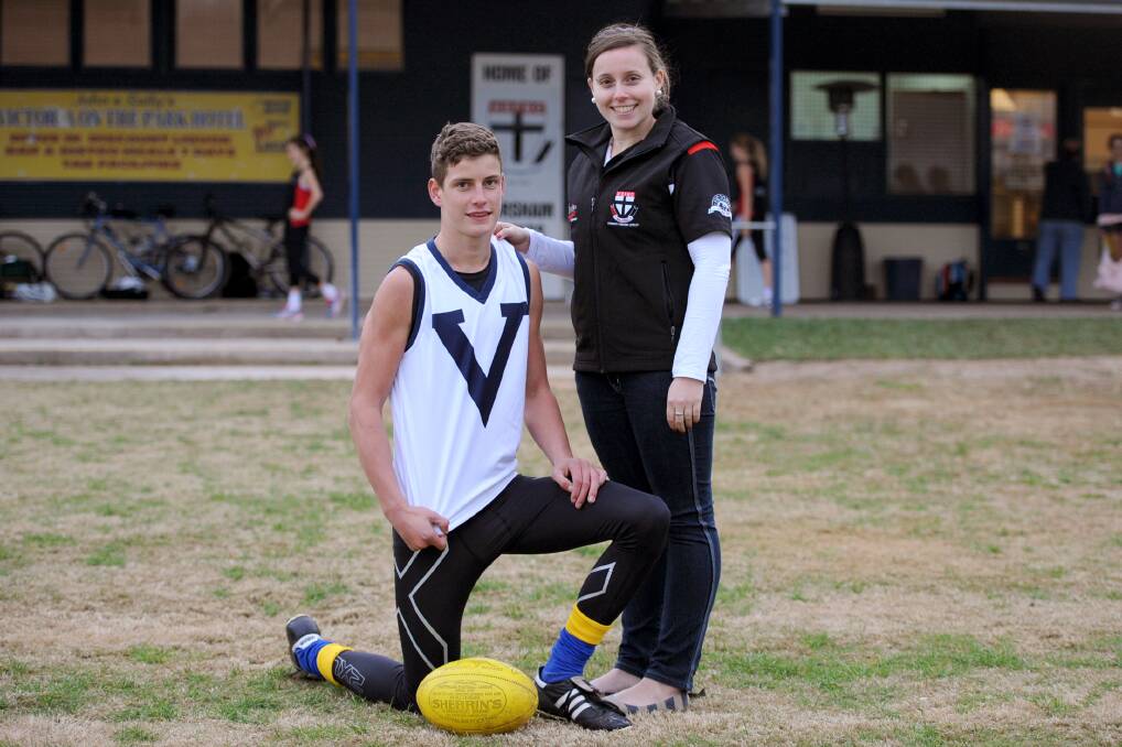 PICKED: Jarrod Berry, pictured with Horsham Saints secretary Eliza Grinter, has been named in an AFL Academy squad for 2014-15. Picture: SAMANTHA CAMARRI
