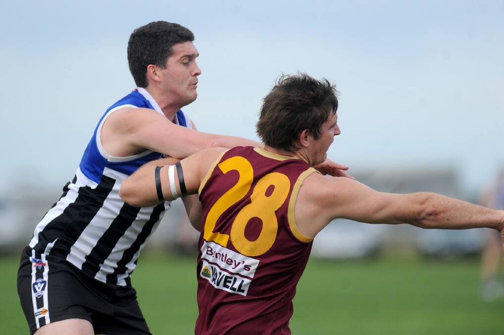 EDGED OUT: Minyip-Murtoa's Daniel Smith works hard to keep Warrack Eagles' Peter Weir off the ball. The Burras were too strong for Warrack Eagles on Saturday. Picture: SAMANTHA CAMARRI