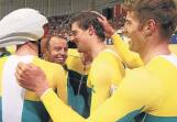 ALL SMILES: Cycling Australia’s men’s track endurance coach Tim Decker, second from the left, celebrates with gold-medal winning pursuit cyclists at the 2014 Commonwealth Games in Glasgow late last month. Picture: GETTY IMAGES