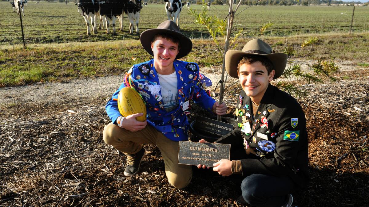 LASTING LEGACY: Horsham exchange students Julien Guerre Berthelot, from France, and Gui Menezes, from Brazil, plant trees at Rotary's plantation in Kalkee Road, Hosham. Picture: PAUL CARRACHER