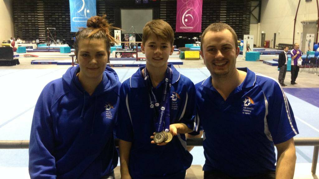 MEDAL HAUL: Horsham gymnast Hudson Irwin, centre, shows off his medals
from the Victorian Gymnastics Championships in Melbourne at the weekend, with
WestVic Academy executive offi cer Rob Ward and fellow Wimmera and WestVic
Academy athlete Emma Werner. Picture: CONTRIBUTED