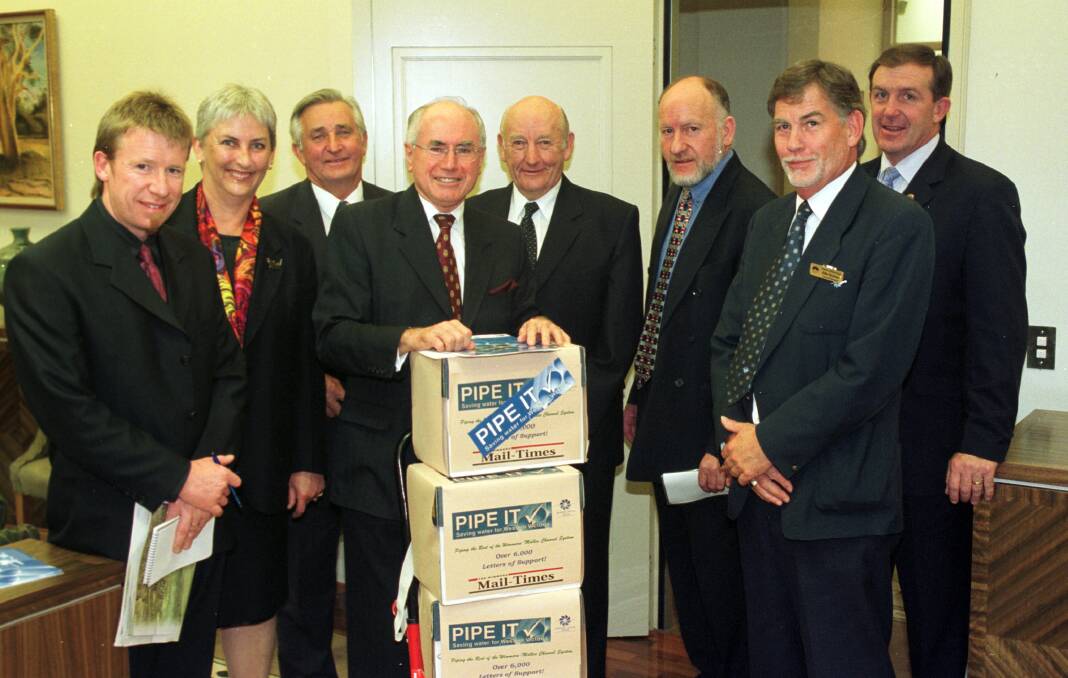 PIPE DREAMS: Former Wimmera Mail-Times editor Danny Lannen, Wimmera Development Association executive director Jo Bourke, Grampians Wimmera Mallee Water chariman Lance Netherway, former Prime Minister John Howard, piping steering committee chairman Stewart Petering, former Member for Mallee John Forrest, Horsham Golf Club president John Konings and Hugh Delahunty during the campaign to build the Wimmera-Mallee pipeline. Picture: PAUL CARRACHER