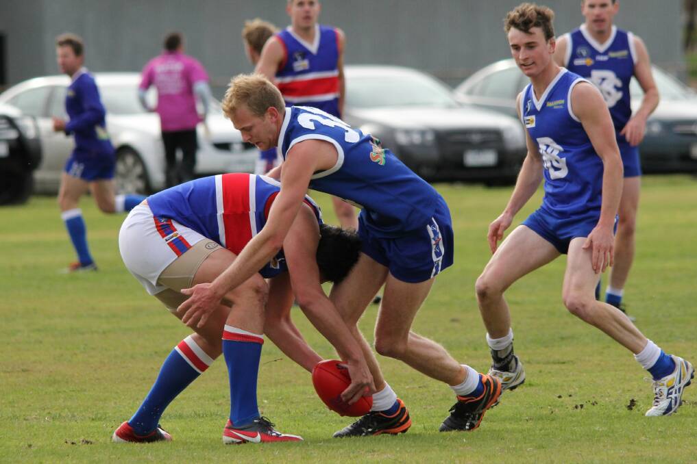 HEAD FIRST: Jeparit-Rainbow ruckman Owen Uaongo crashes into a Beulah opponent at the weekend.Picture: LES GRAETZ